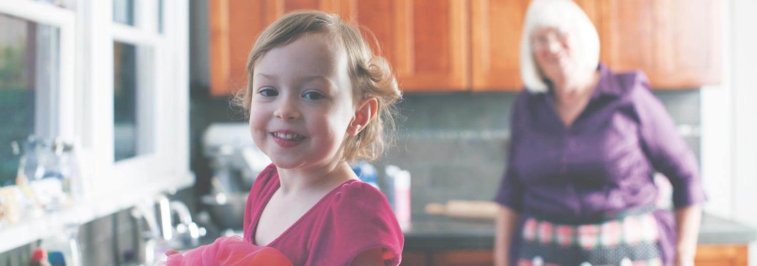 A grandmother and her granddaughter in the kitchen