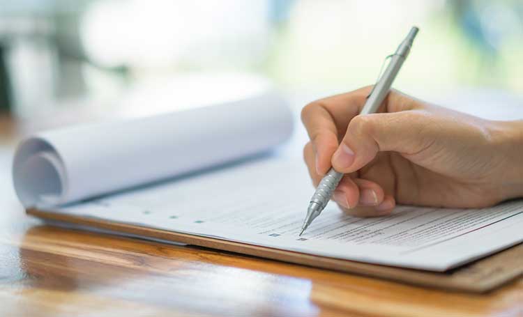 someone completing an application form