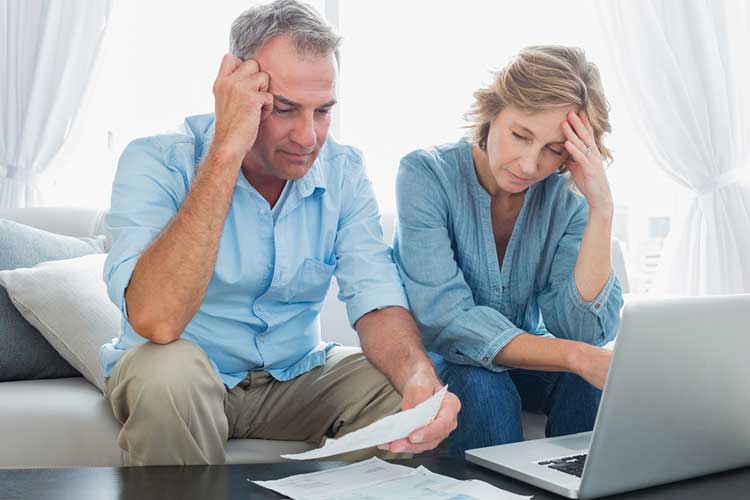 mature couple looking at their finances