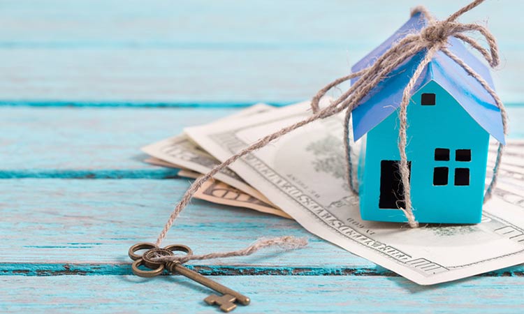 How Much Equity Can I Release Access Tax Free Cash Sunlife Small Blue Wooden House Sitting On Bank Notes Next To A Key
