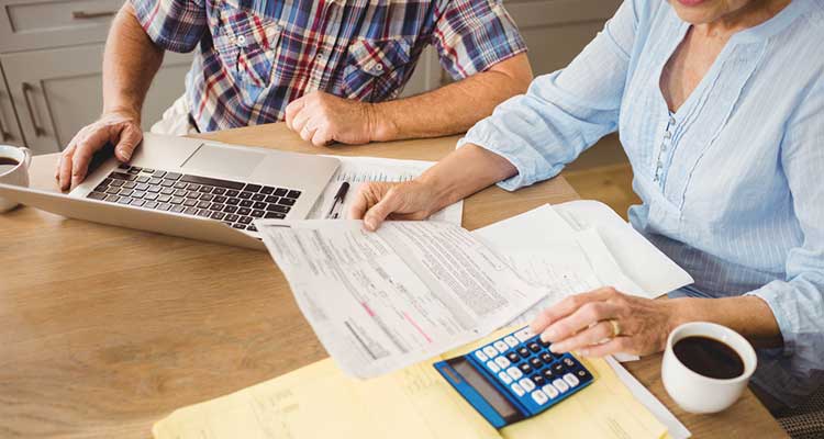 couple calculating their financial position