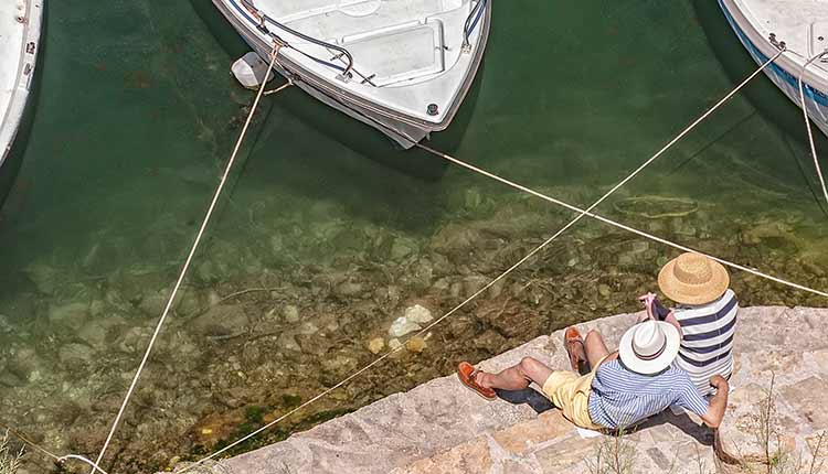 couple looking at moored boats