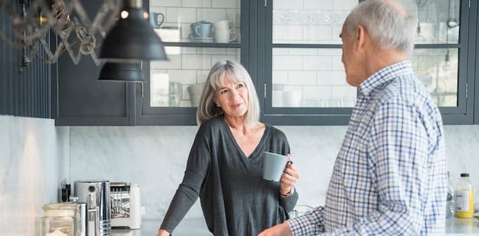 couple in their kitchen talking