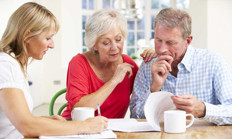 mature couple looking over some papers