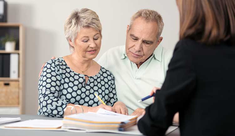 middle-aged couple discussing their finances