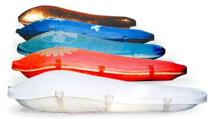a row of paper ecopod coffins
