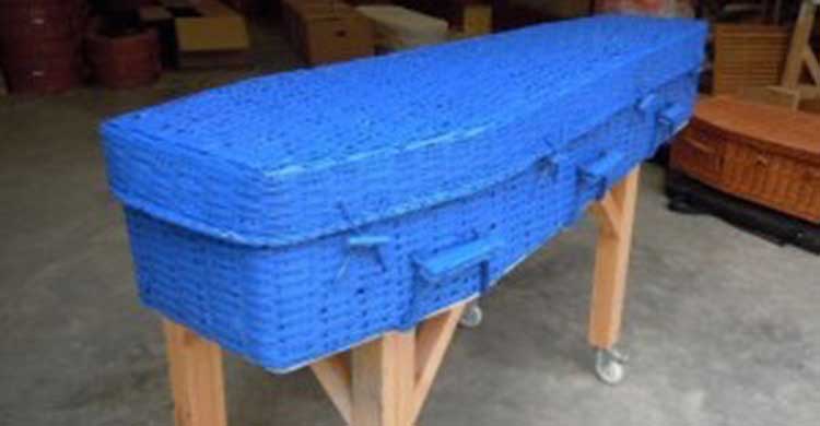 Bright blue wicker coffin made from bamboo