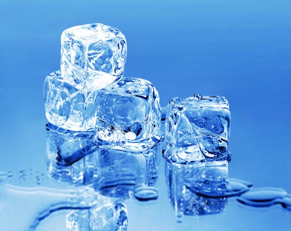 Ice cubes piled up on a cool blue background