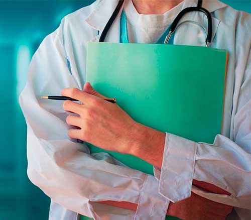 close up of medical student wearing stethoscope holding folder