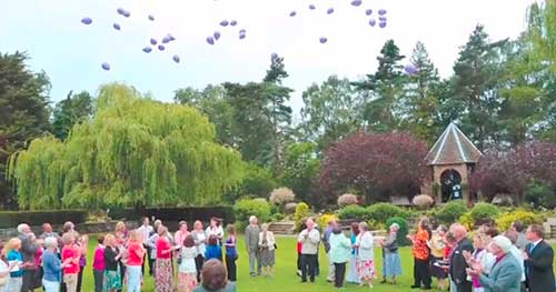 humanist funeral outdoors releasing balloons