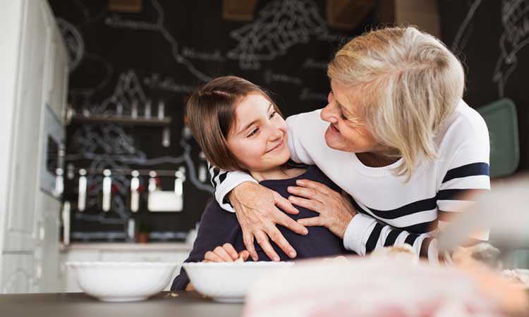 grandmother embracing her grandaughter