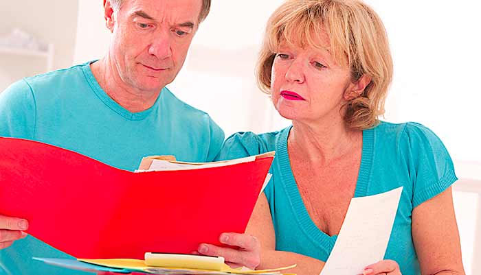 couple looking at administrative and financial document