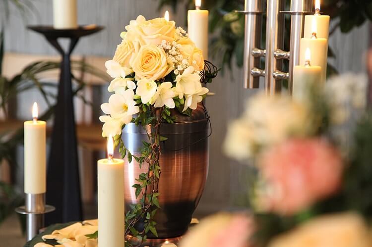 Urn with flowers and candles