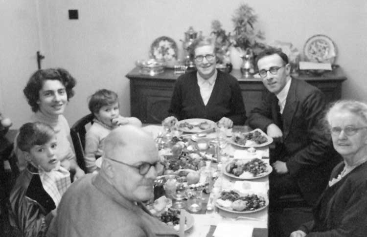 Extended family eating Christmas dinner