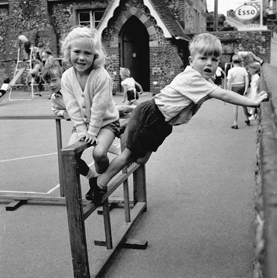Children on a climbing frame in a school playground