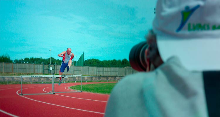 alex photographing an over 50s hurdler in action