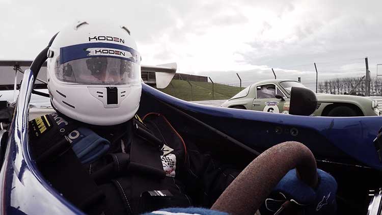 philip in the driving seat of a race car
