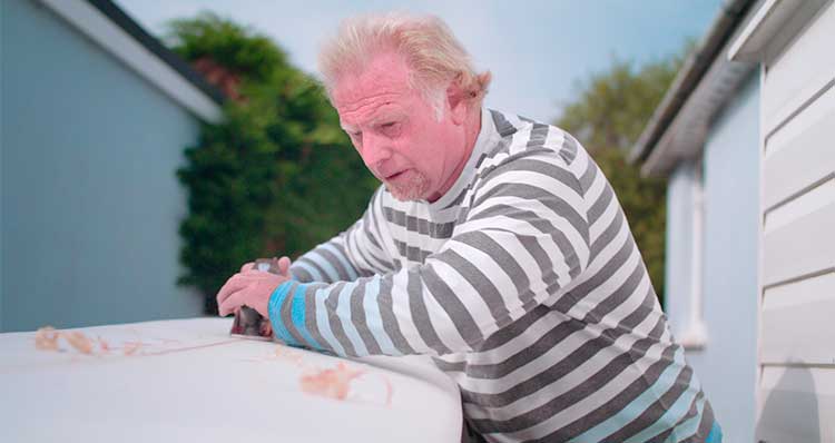 Steve making a surf board