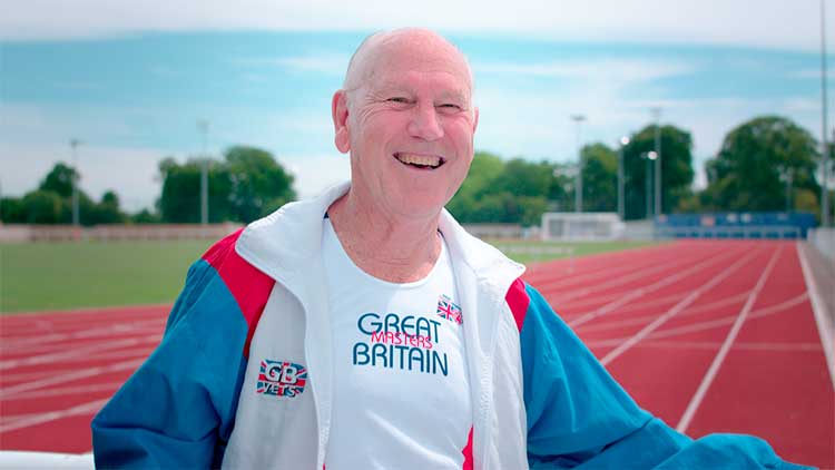 tony standing on the track smiling