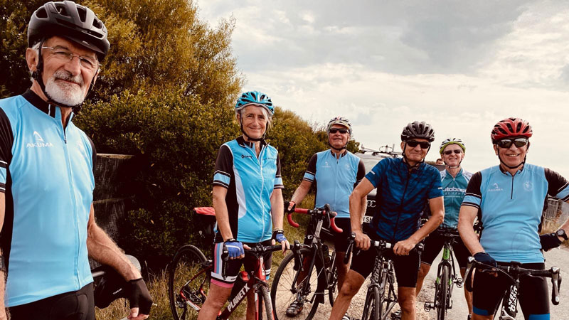 Group of cyclists wearing a team uniform